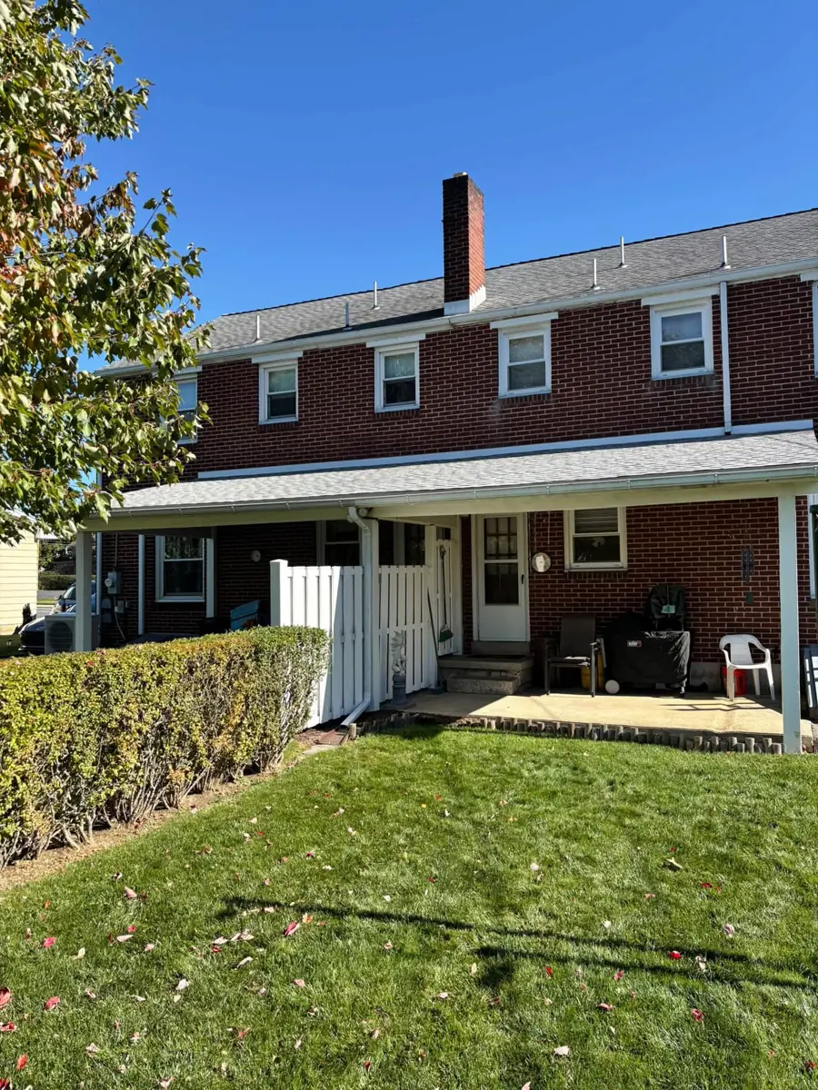 Finished roof on a brick colonial