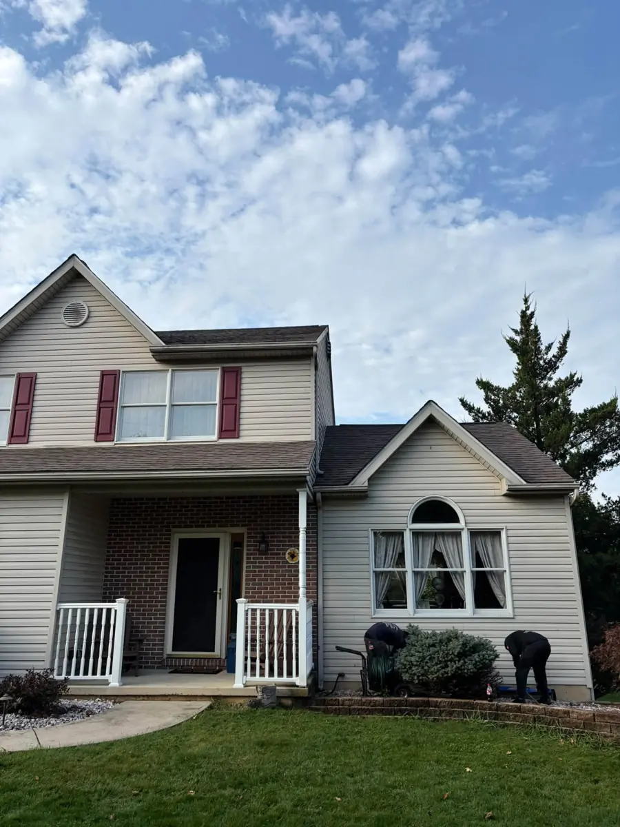 Two-story home with a new roof